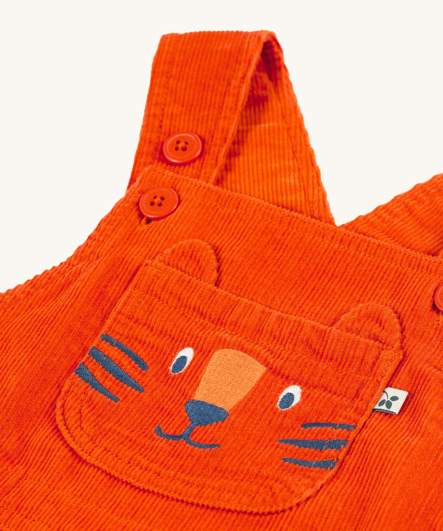 A closer look at the embroidered tiger on the Frugi Durgan Cord Dungaree - Bonfire/Tiger