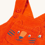 A closer look at the embroidered tiger on the Frugi Durgan Cord Dungaree - Bonfire/Tiger