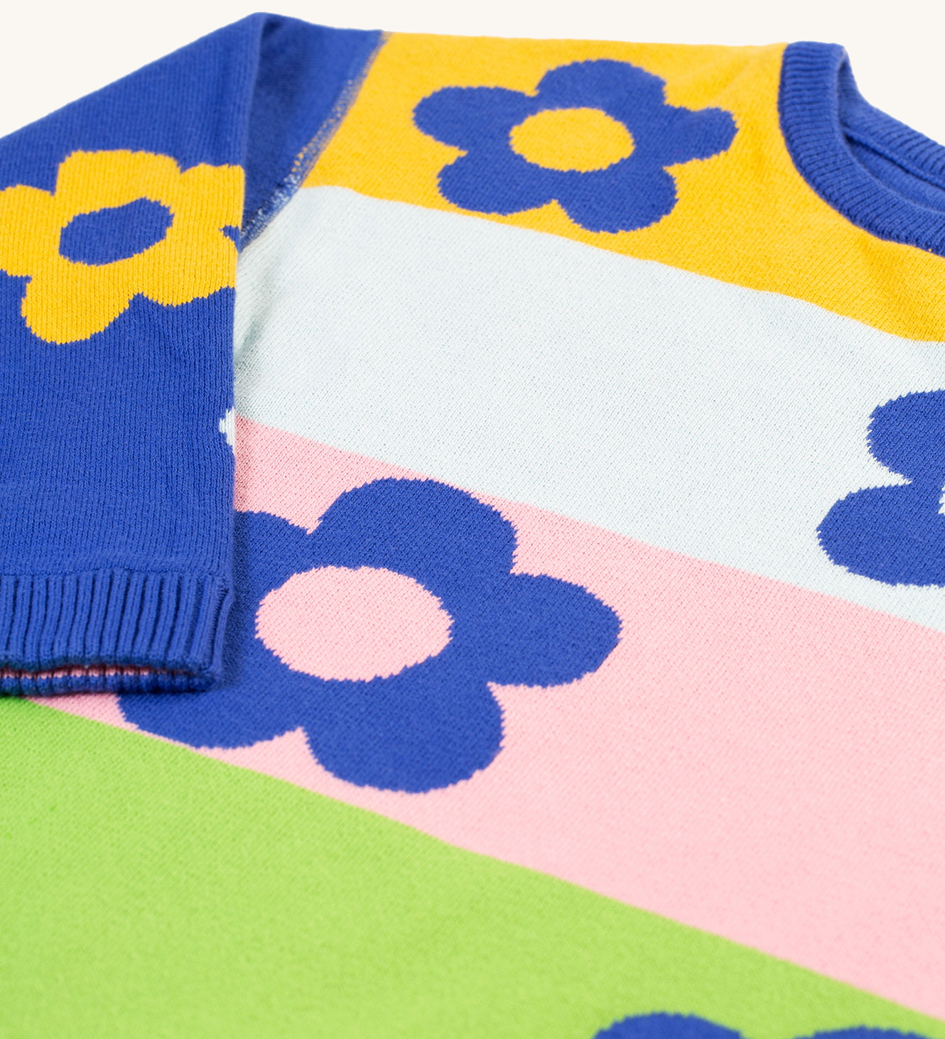 A closer look at the colour-block print on the Frugi Zola Reversible Knitted Dress - Blue Tang/Retro Floral