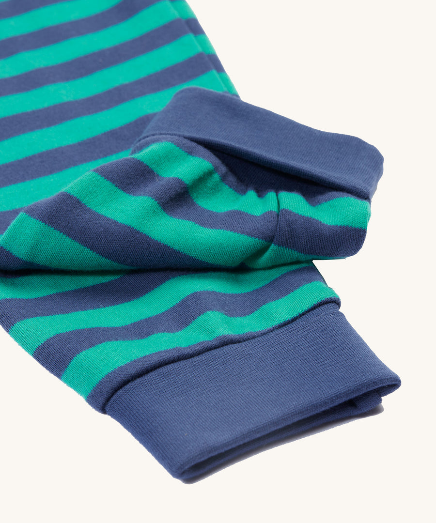 A closer look at the green and navy striped pyjama bottoms on the Frugi Jamie Jim Jams - Iguana Stripe/Camper