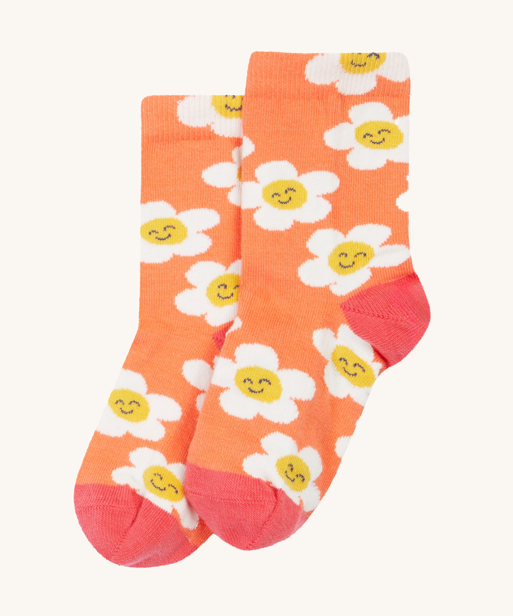 The orange sock with white flowers from the Frugi Rock My Socks - Stay Wild 3 Pack