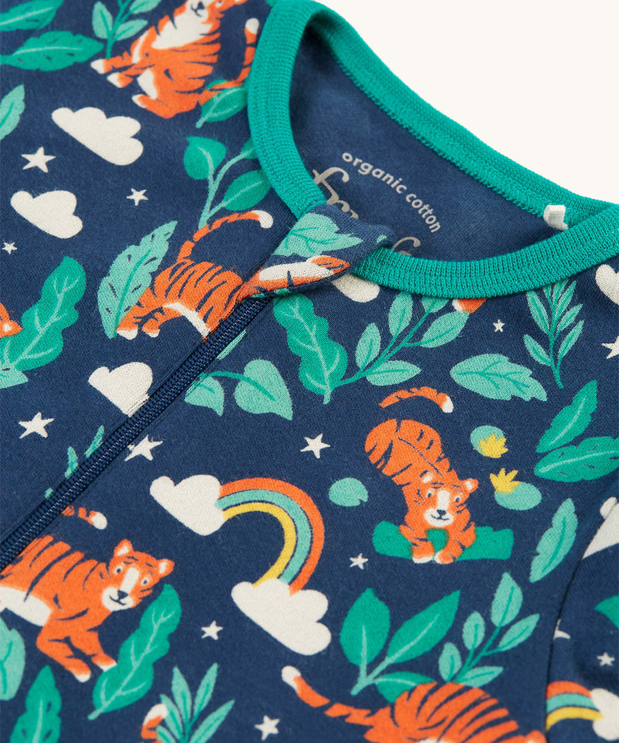 A closer look at the zipper and print on the Frugi Zelah Zip Up All In One - Roarsome!