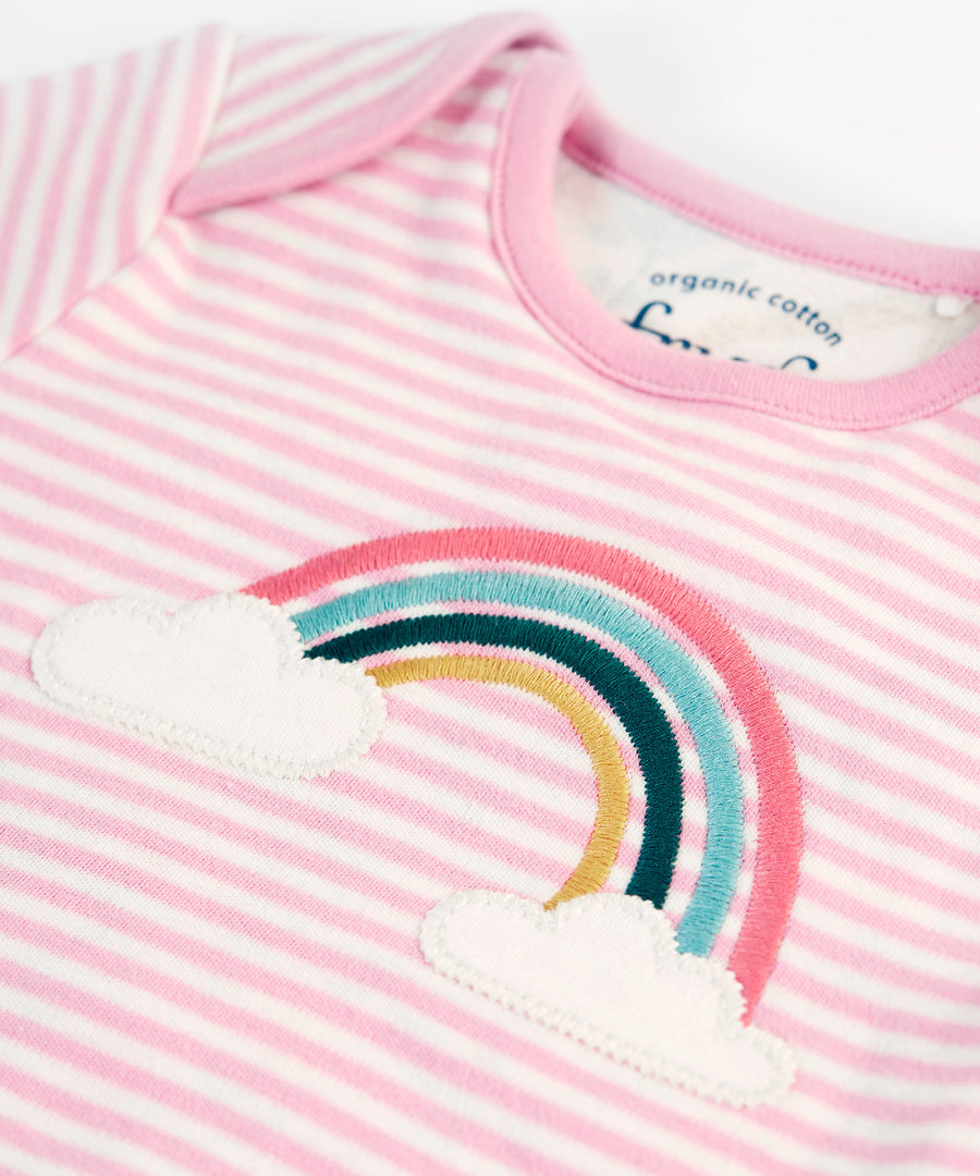 A closer look at the embroidered rainbow on the pink and white stripe top