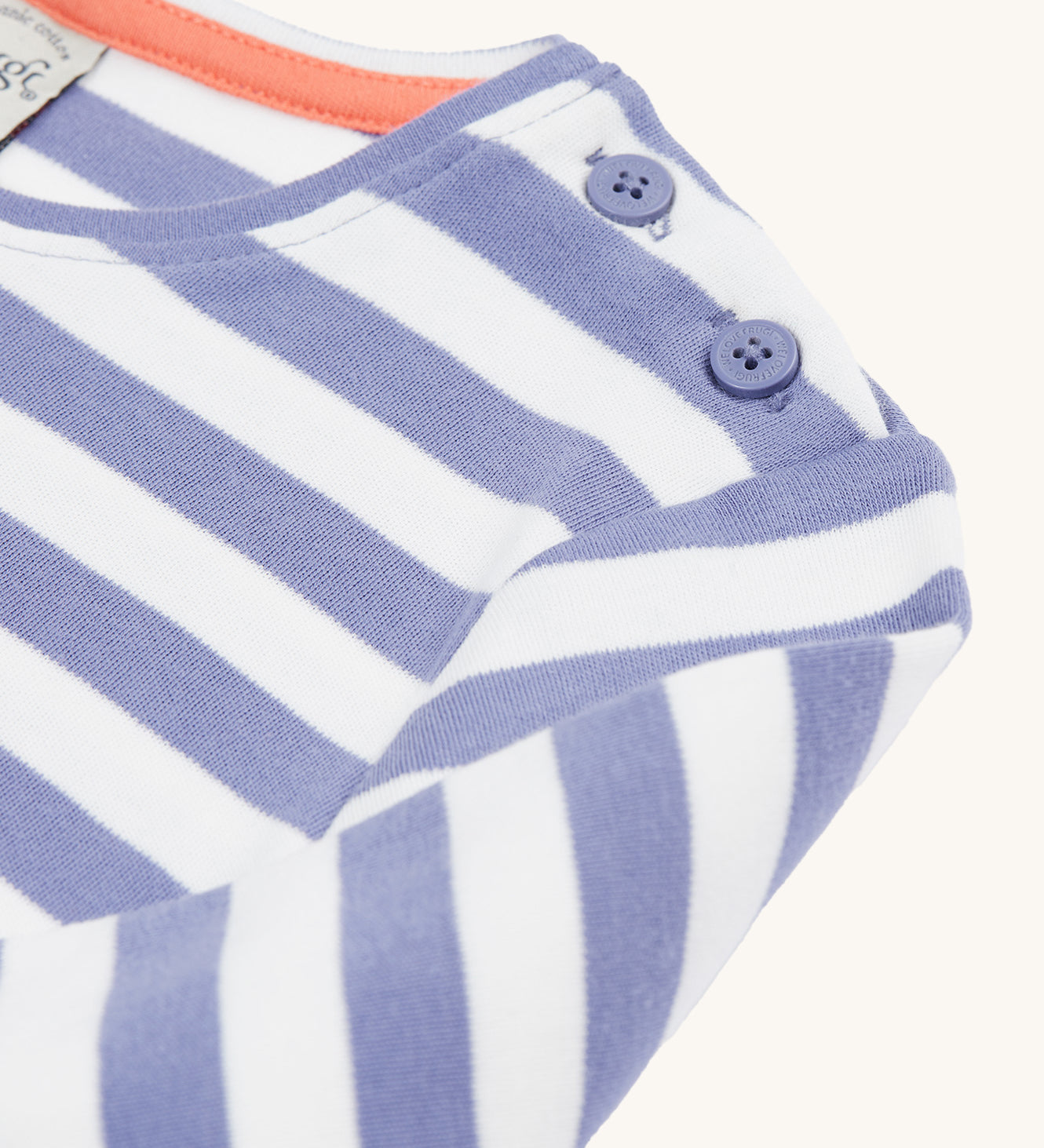 A closer look at the shoulder on the Frugi Louise Applique Top - Grape Stripe/Rainbow. The image shows the shoulder buttons, and the lilac and white stripes on the top