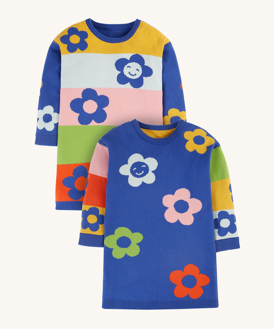 Frugi Zola Reversible Knitted Dress - Blue Tang/Retro Floral. A beautiful knitted, long sleeve dress with a gorgeous retro colour-block fabric and floral patterns. The image shows the dress with colour-block body and blue sleeves, and the reverse with a blue body and colour-block sleeves. Both sides have bold, colourful floral prints.