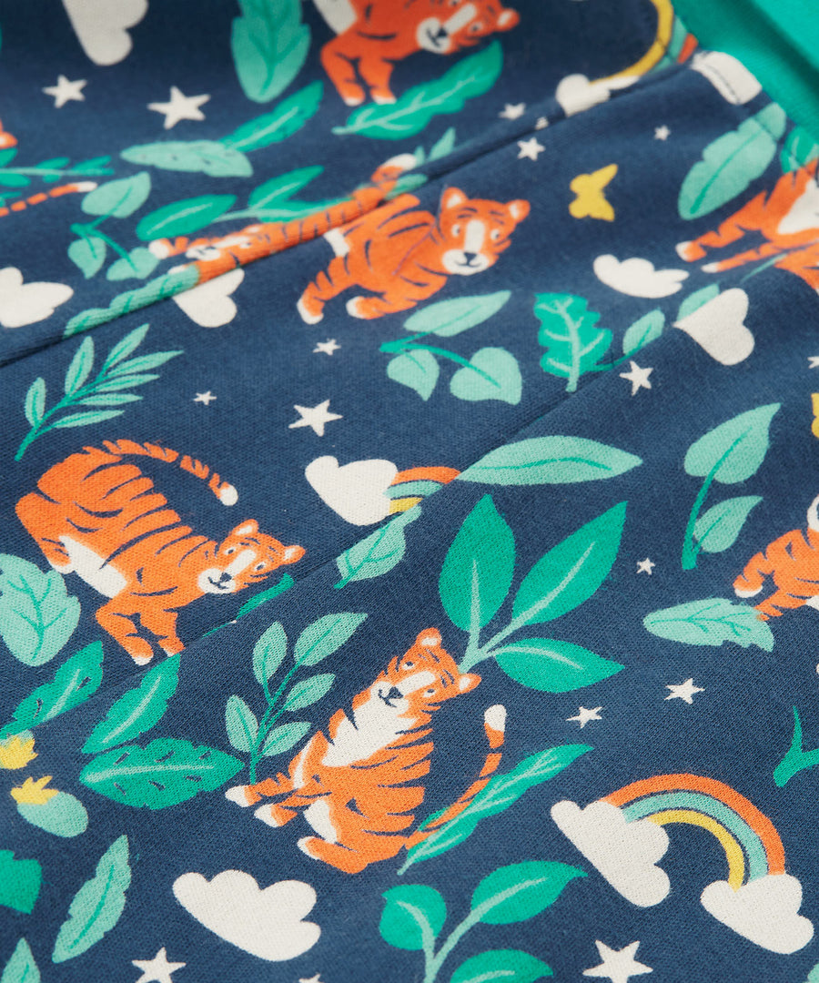 A closer look at the playful tiger, leaf and rainbow print on the Frugi Parsnip Pants - Roarsome!