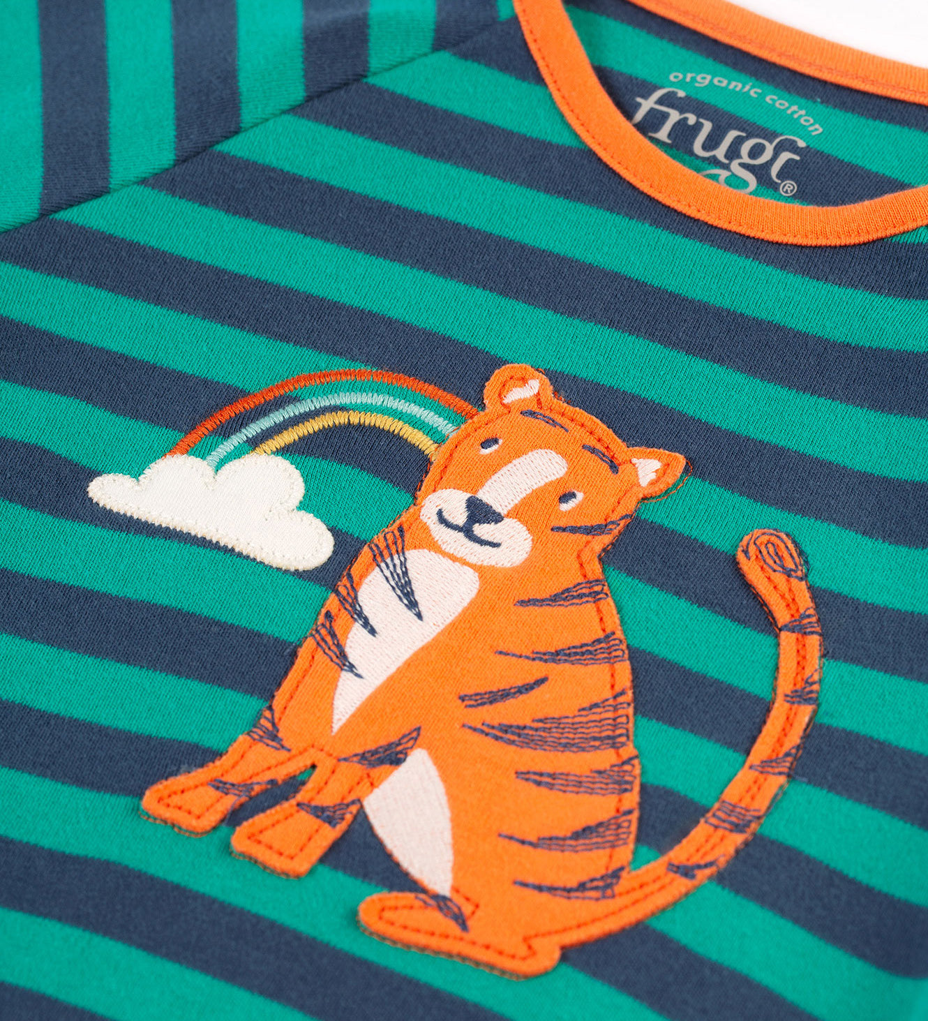 A closer look at the tiger and rainbow applique on the Frugi Rowan Romper - Iguana Stripe/Tiger