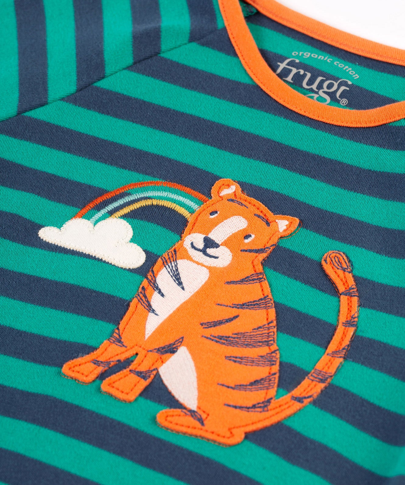 A closer look at the tiger and rainbow applique on the Frugi Rowan Romper - Iguana Stripe/Tiger