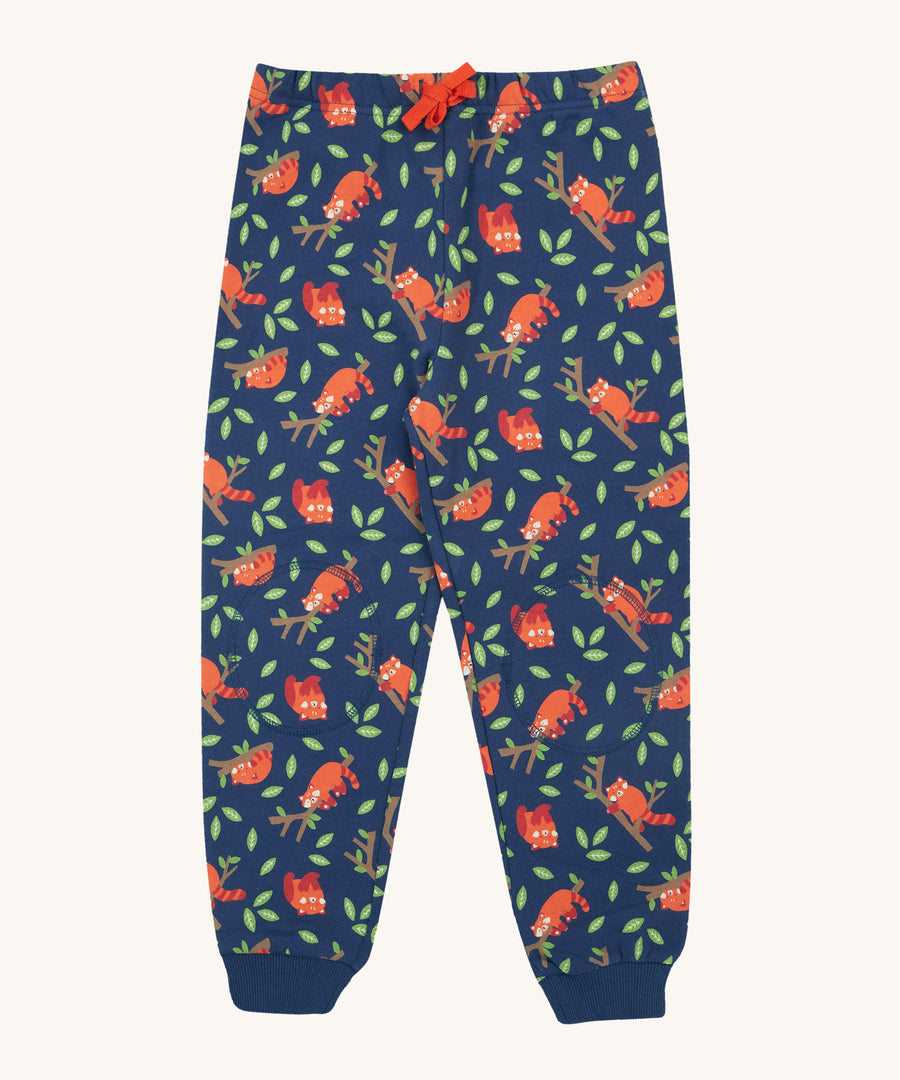 Frugi Snuggle Crawlers - Red Panda Pals. Soft, organic cotton trousers, perfect for crawling due to the protective double layer knee patches. The print on these trousers consist of cute, sleeping, red pandas on tree branches, and green leaves and a red drawcord in the waistband 