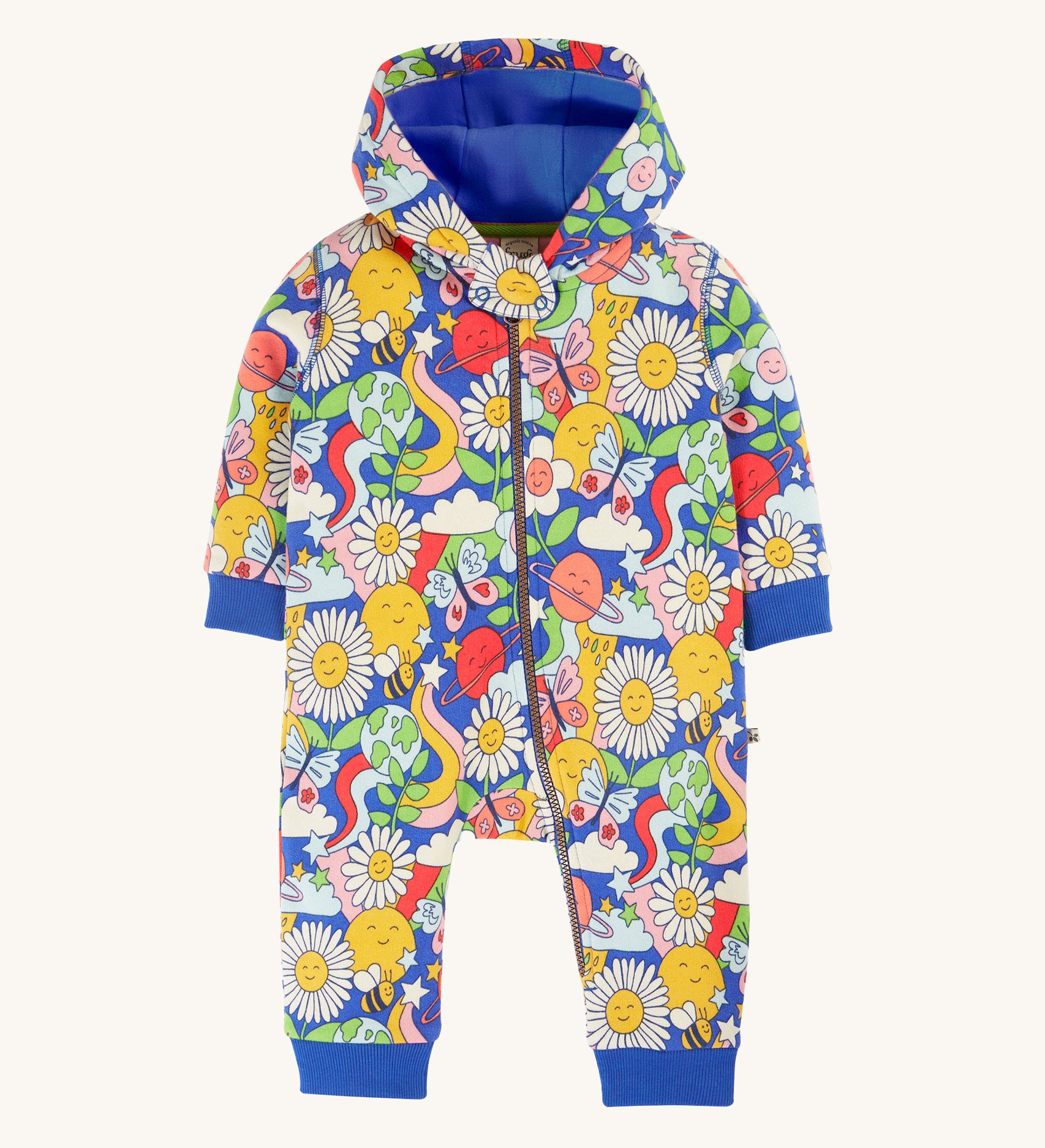 Frugi Snuggle Suit - Retro Happy. A soft and warm, hooded snuggle suit, made from organic cotton. With an all-over print, featuring smiley faces, daisies, butterflies, and bees