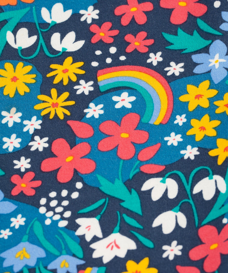 A closer look at the floral and rainbow print on the Frugi Libby Leggings - Winter Hedgerow