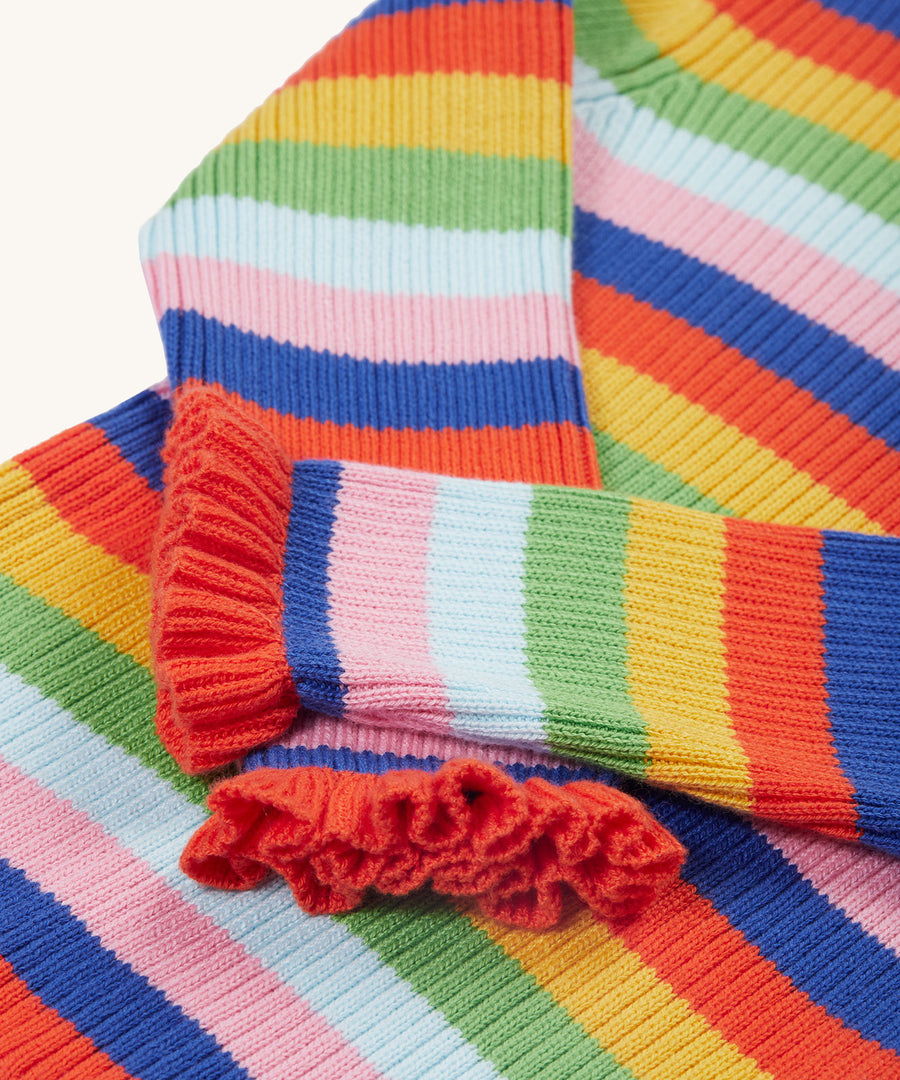 A closer look at the lovely ruffled wrist cuffs on the Frugi Zoe Knitted Jumper - Retro Stripe. The image also shows the bright and bold colour-block fabric