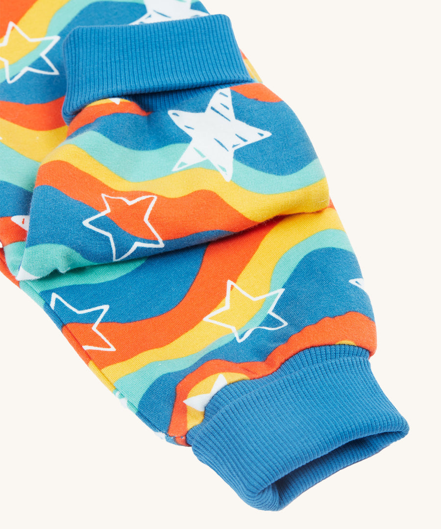 A closer look at the ribbed ankle cuffs on the Frugi Cosy Parsnip Pants - Wavy Stars/Protect Your Planet.