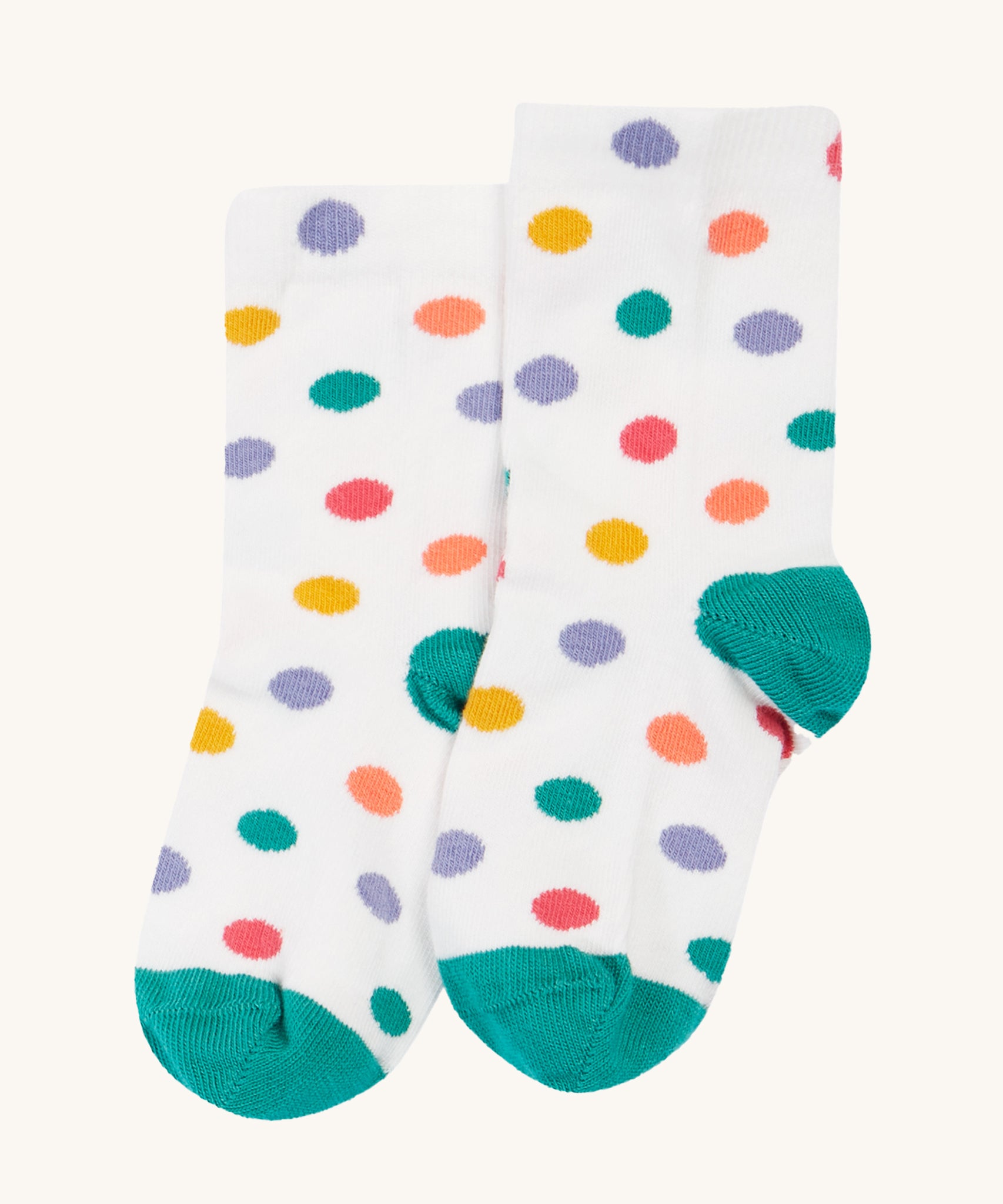 The white with polka dot print socks from the Frugi Rock My Socks - Stay Wild 3 Pack