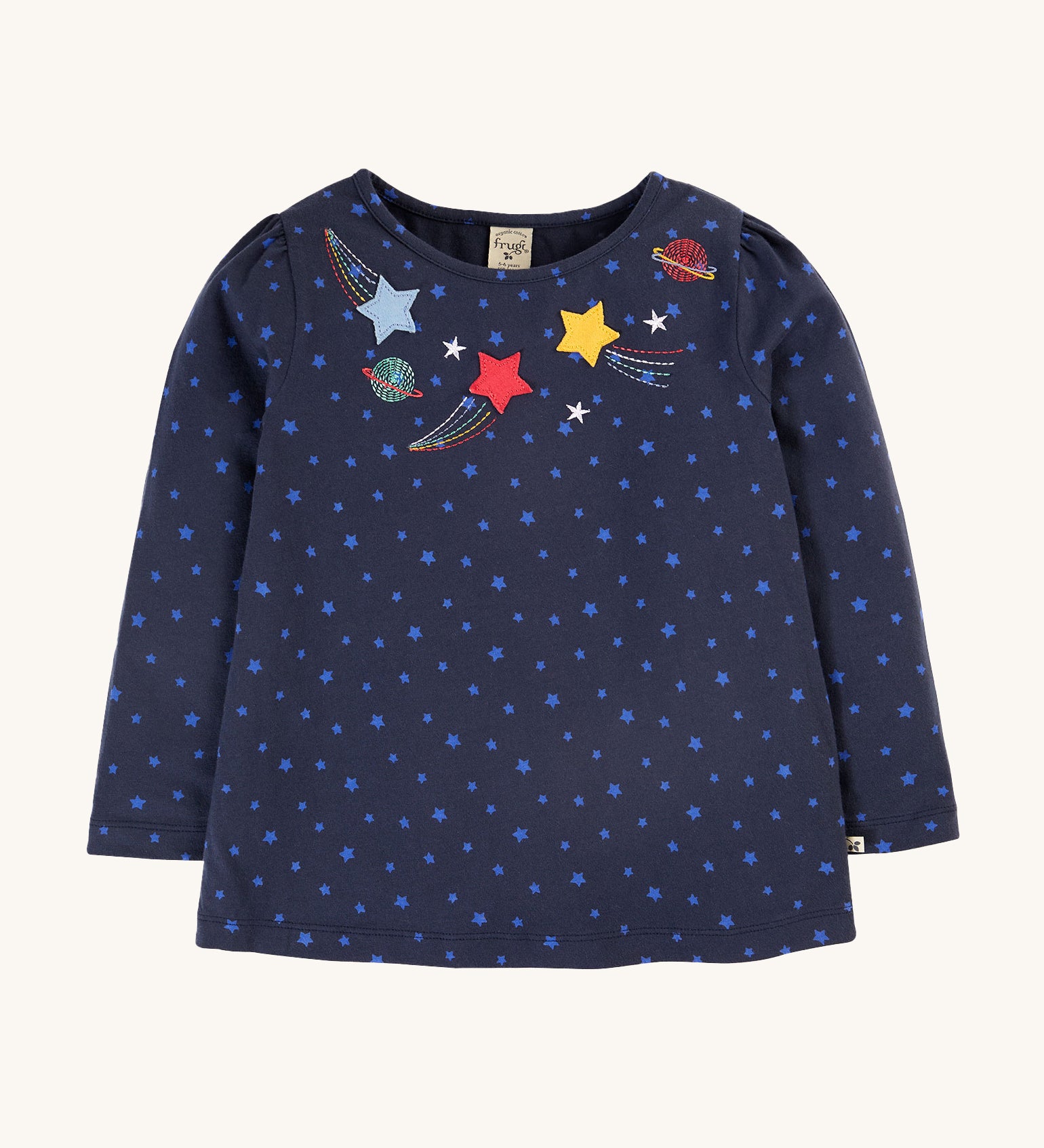 Frugi Laia Top - Starry Night/Space. A soft, organic cotton, navy blue, long sleeve top with light blue star pattern, with star and planet applique details around the neck collar