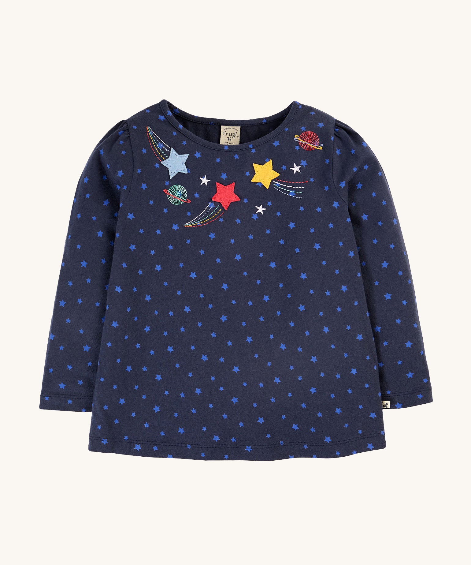 Frugi Laia Top - Starry Night/Space. A soft, organic cotton, navy blue, long sleeve top with light blue star pattern, with star and planet applique details around the neck collar