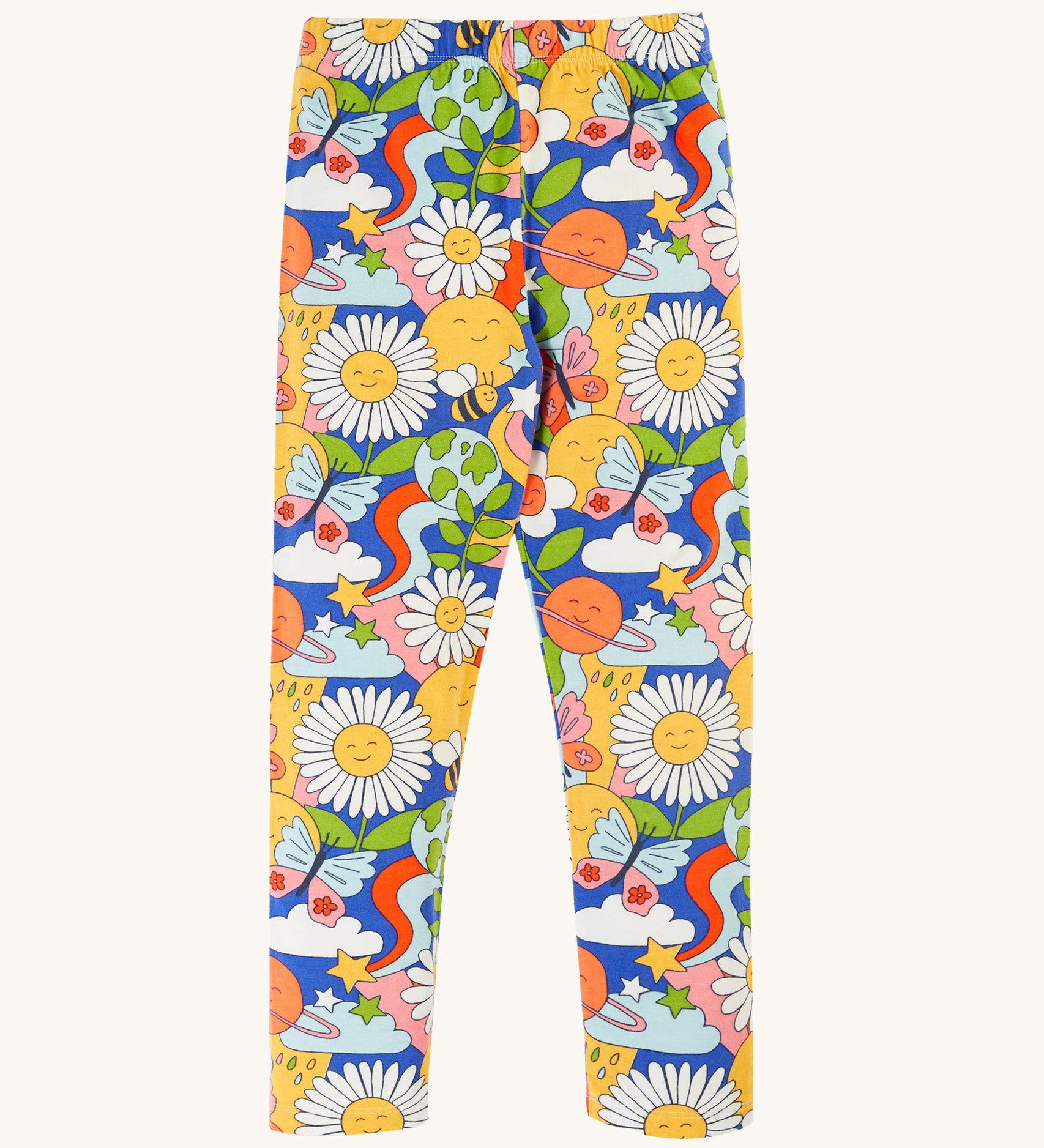 Frugi Libby Printed Leggings - Retro Happy. Organic cotton leggings in a fun retro print, which includes smiley faces, daisies, clouds, rainbow swirls, planets butterflies, and bees on a royal blue fabric.