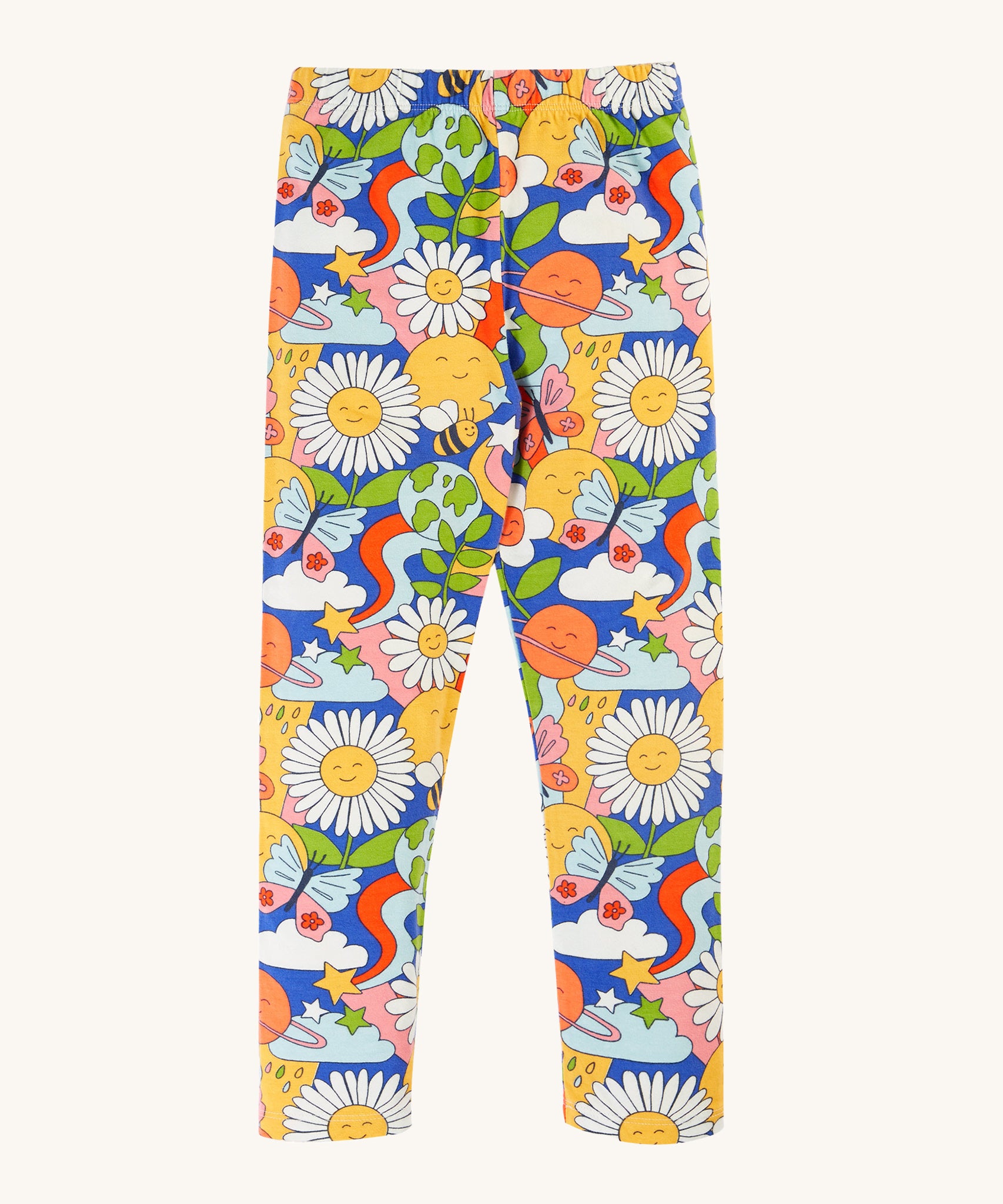 Frugi Libby Printed Leggings - Retro Happy. Organic cotton leggings in a fun retro print, which includes smiley faces, daisies, clouds, rainbow swirls, planets butterflies, and bees on a royal blue fabric.