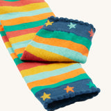 A closer look at the angle cuffs on teh Frugi Little Knitted Leggings - Rainbow Stripe/Tractor, with colourful stars and striped legs