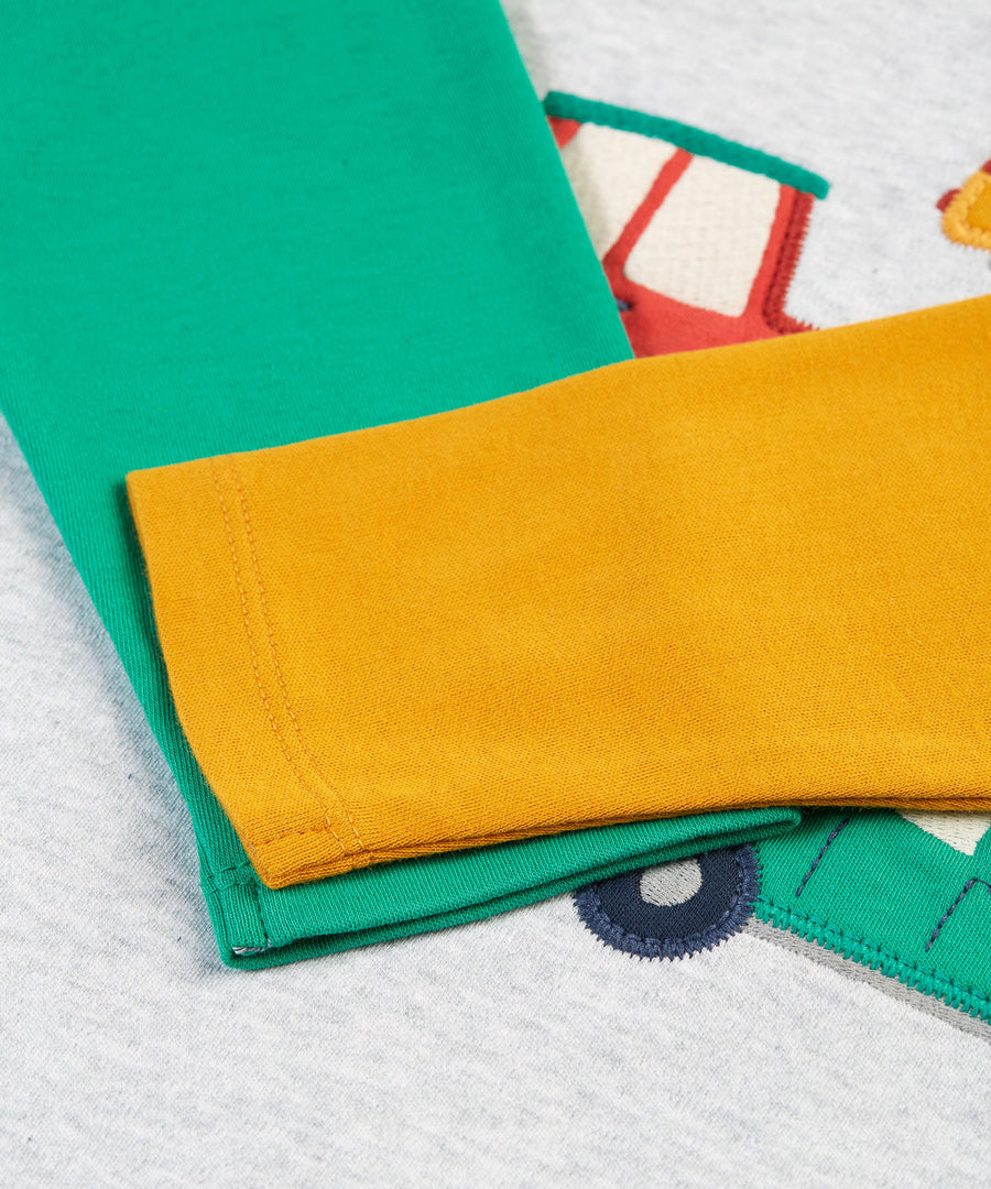 A look at the colourful sleeves on the Frugi Alfie Raglan Top - Grey Marl/Vehicles