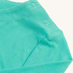 The shoulder popper fasteners on the Frugi Anna Applique Top - Pacific Aqua/Horse