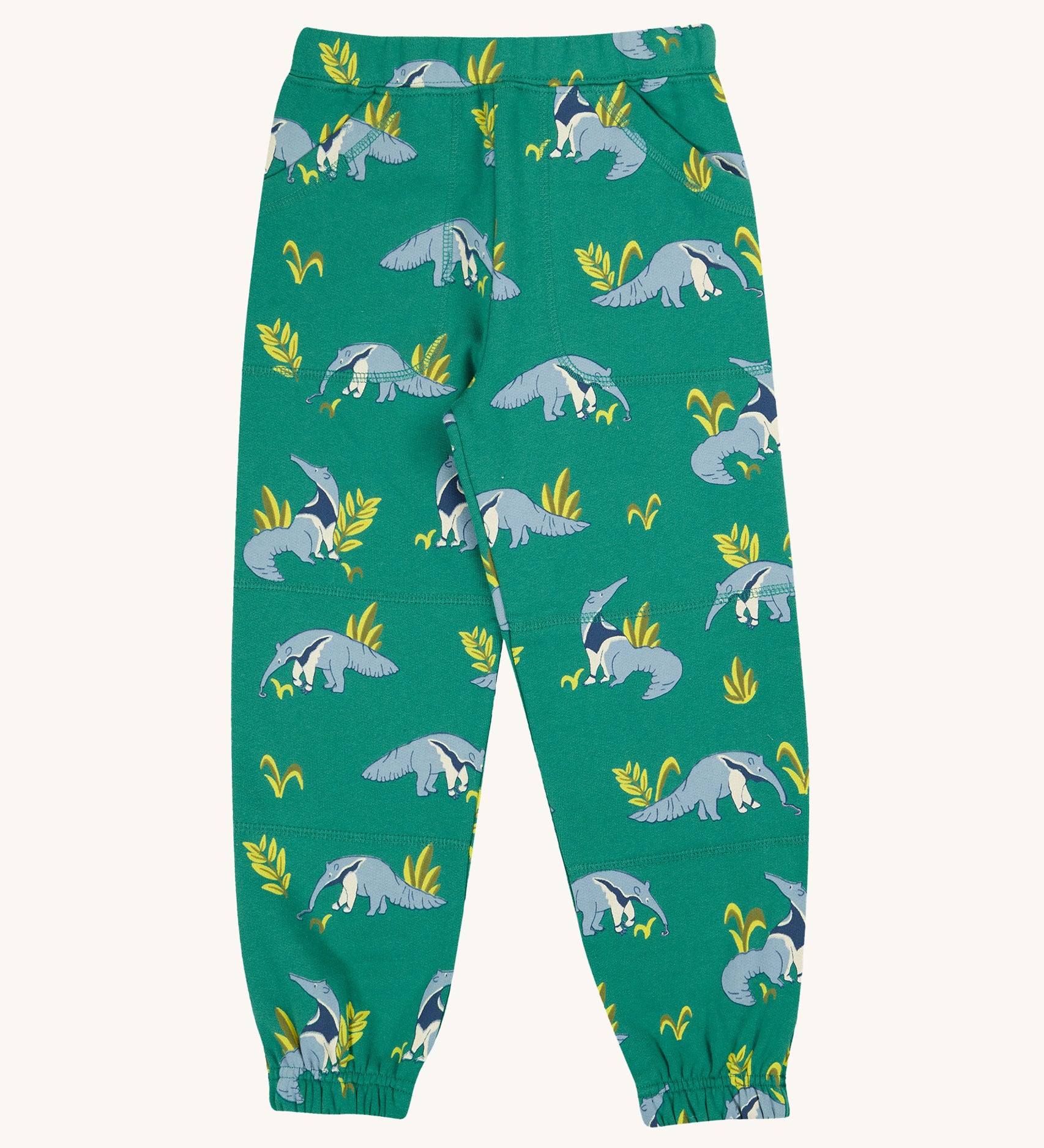 Frugi Malpas Joggers - Anteater Parade. These joggers are in green fabric with a repeat anteater and leaf print. They also have an elasticated waist, ankle cuffs and pockets