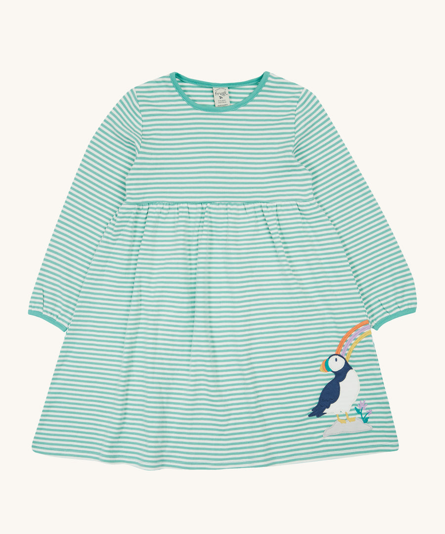 Frugi Dolcie Dress - Moss Stripe/Puffin Rainbow. A beautiful moss green and white stripe long sleeve dress, with a Frugi puffin applique on the bottom of the dress skirt