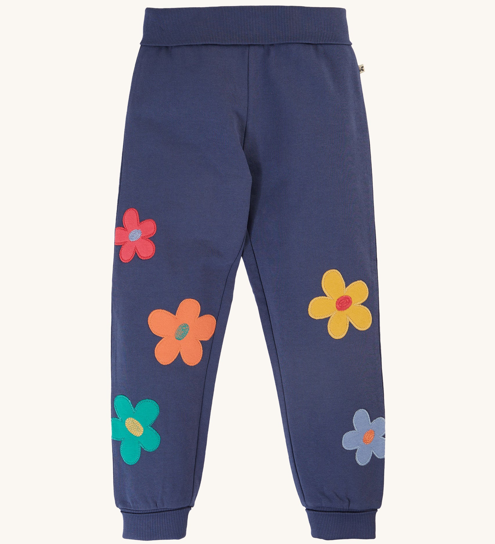 Frugi Perrin Parsnip Jogger - Navy Blue/Flowers. A navy blur fabric, with colourful flower appliques