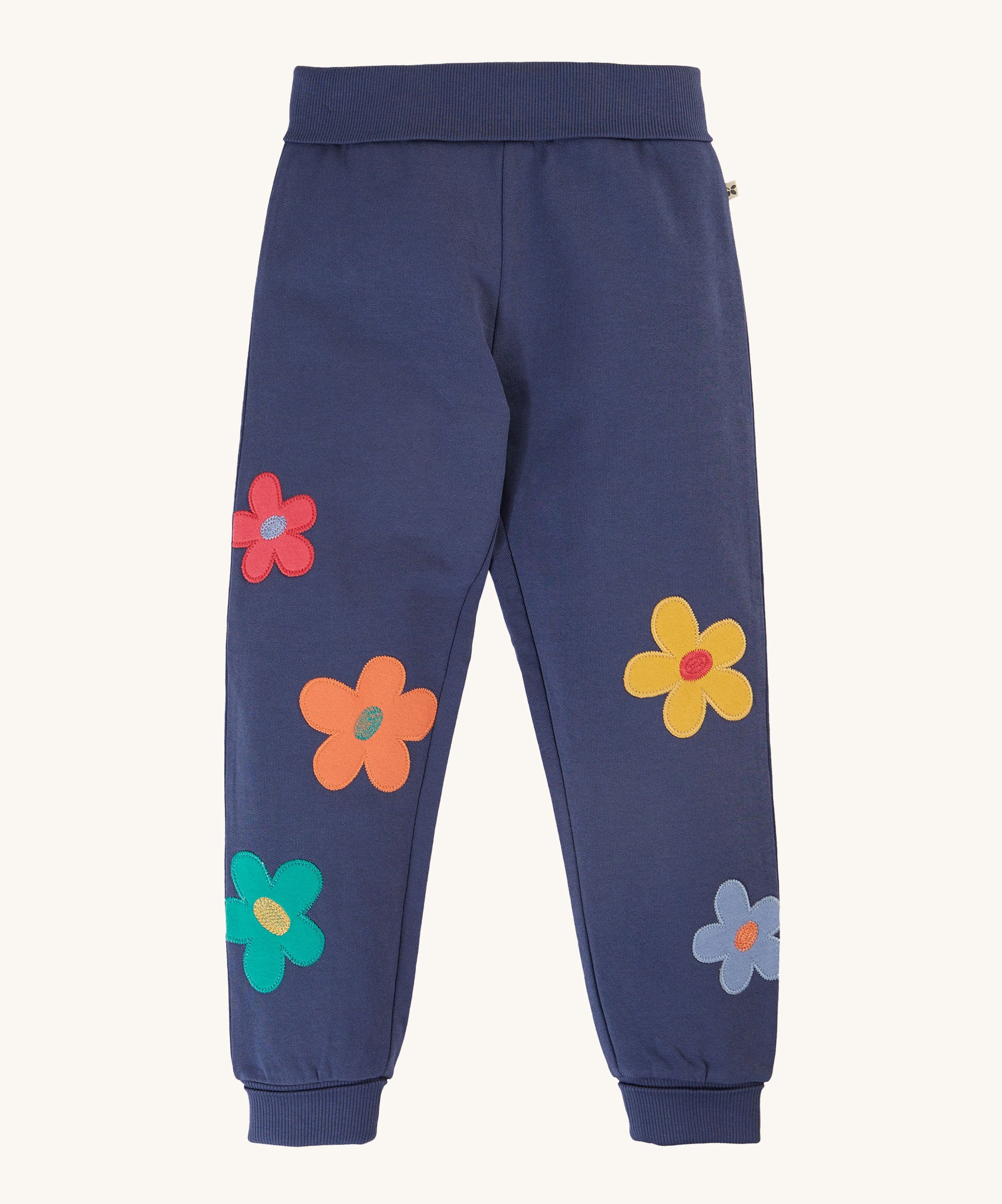 Frugi Perrin Parsnip Jogger - Navy Blue/Flowers. A navy blur fabric, with colourful flower appliques