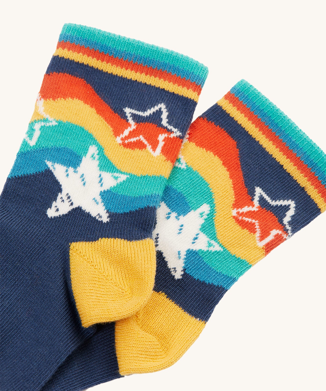 A closer look at the navy rainbow star print socks, from the Frugi Little Socks - Stars 2 Pack