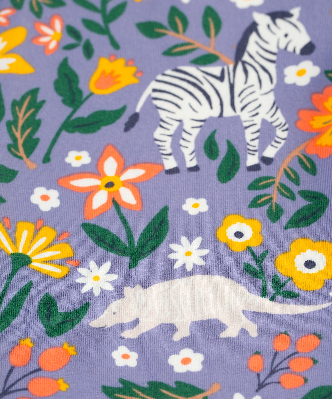 A closer look at the print on the Frugi Libby Printed Leggings - Rainforest Friends,with zebras, flamingos, parrots, and more wild friends print.