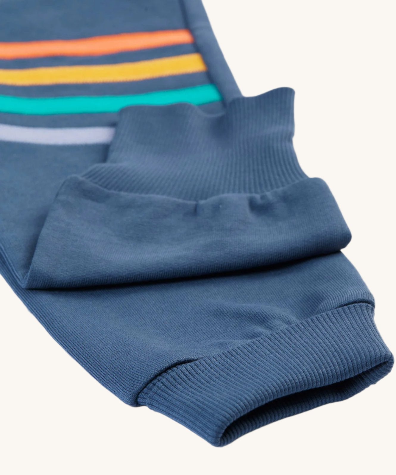 A look a the the turn over ankle cuffs on the Frugi Perrin Parsnip Jogger - Navy Blue/Stripe