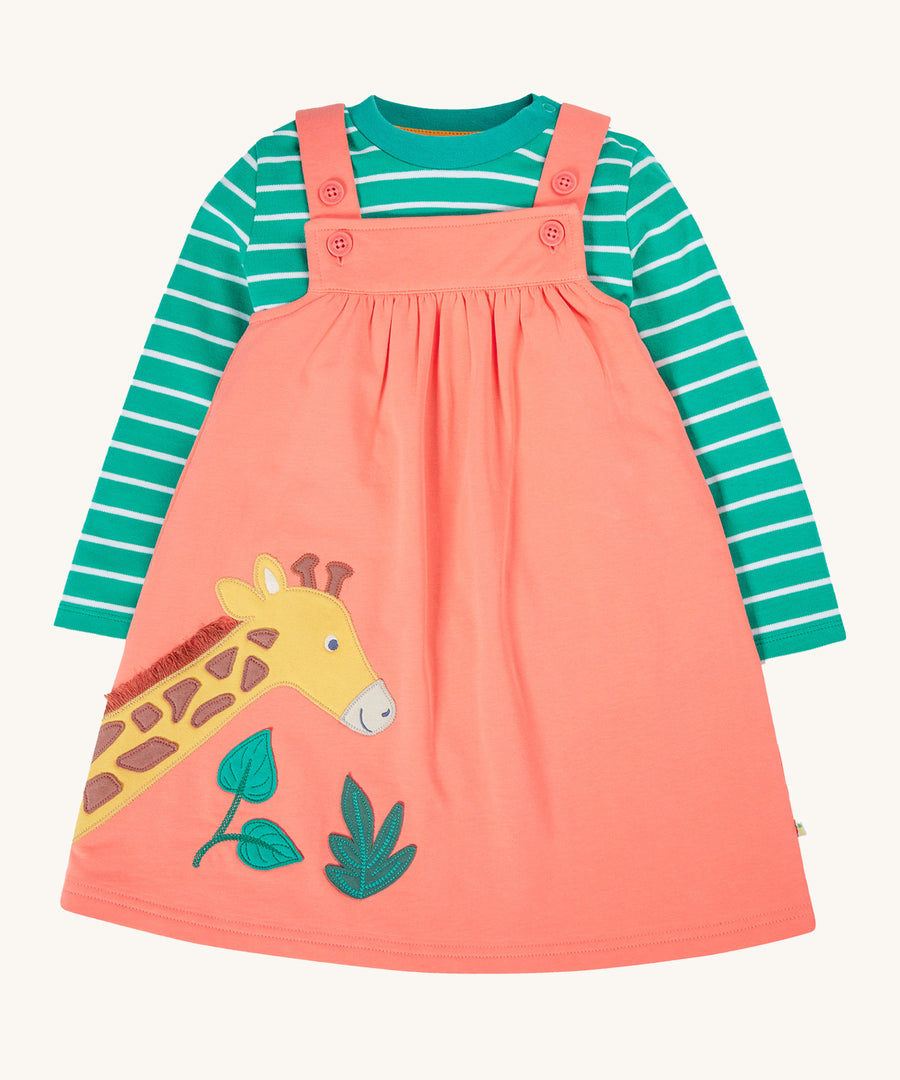 Frugi Paige Pinafore Outfit - Cantaloupe/Iguana Breton. A lovely peach pinafore dress with a giraffe and leaf applique on the front, and a green and white stripe top