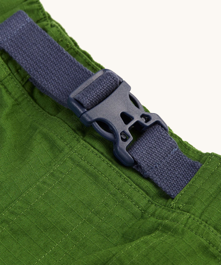 A closer look at the Navy Blue waist buckle on the Frugi Pioneer Trousers - Jungle Green