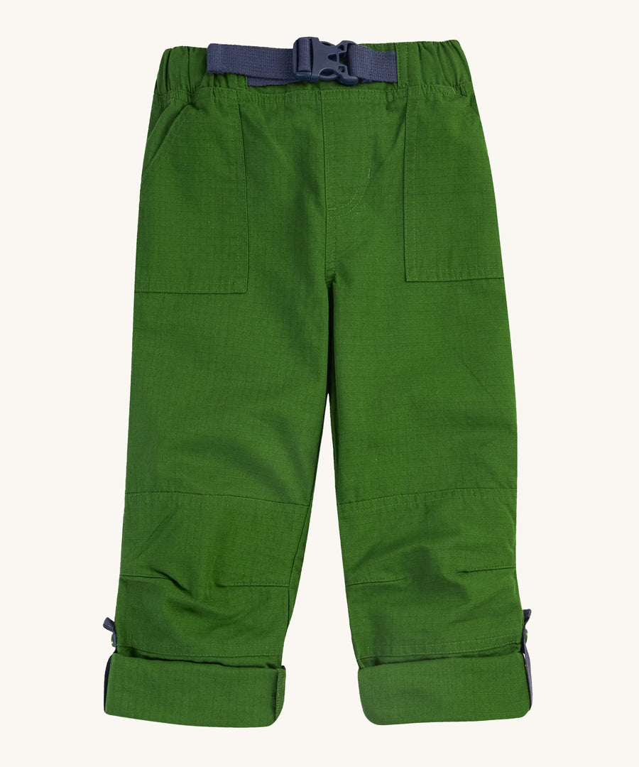 The adjustable legs turned up on the Frugi Pioneer Trousers - Jungle Green