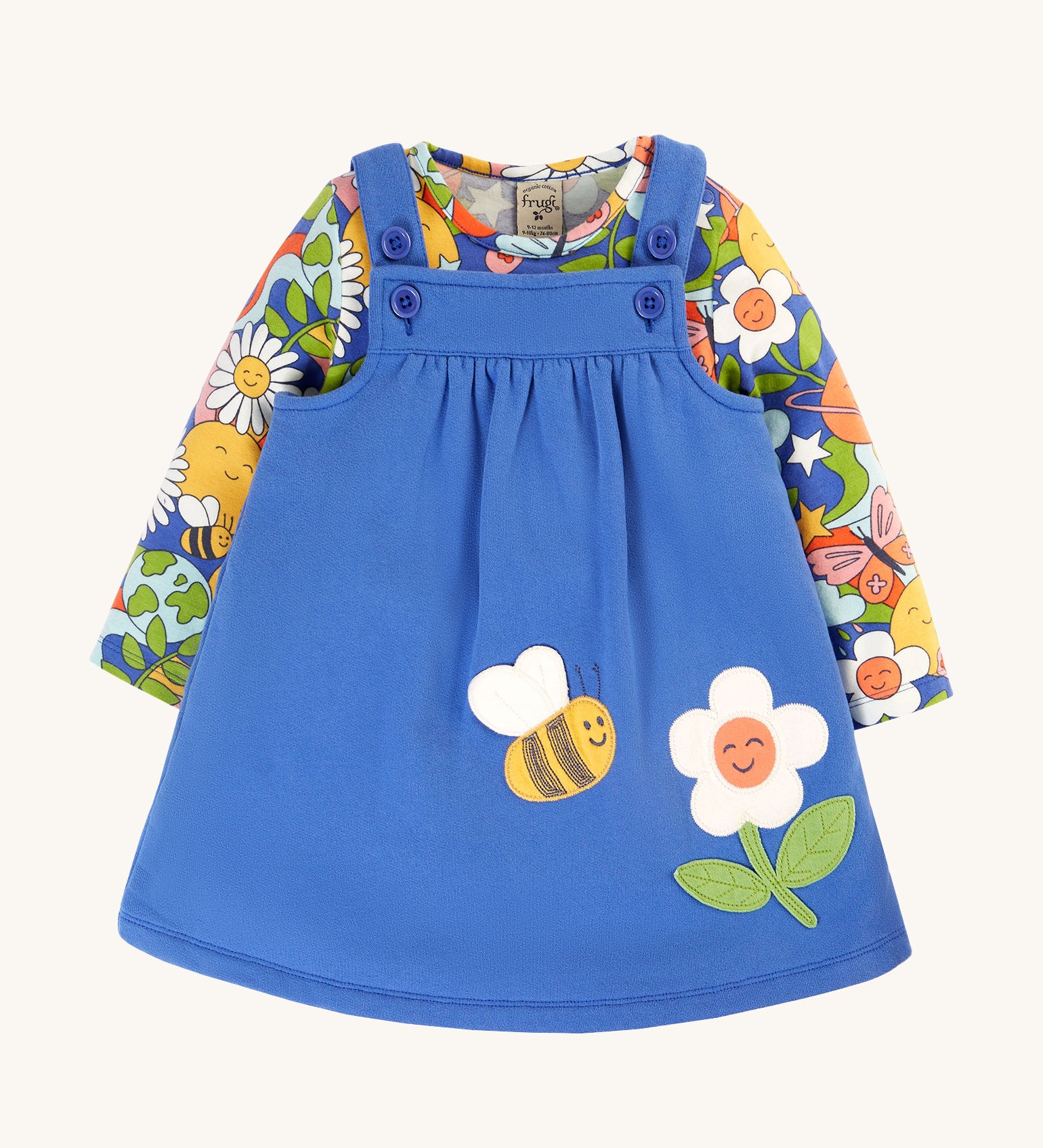 Frugi Polly Pinafore Outfit - Blue Tang/Retro Happy. A beautiful, organic cotton outfit with a blue, adjustable strap pinafore dress, and a long sleeve Retro Happy print top.