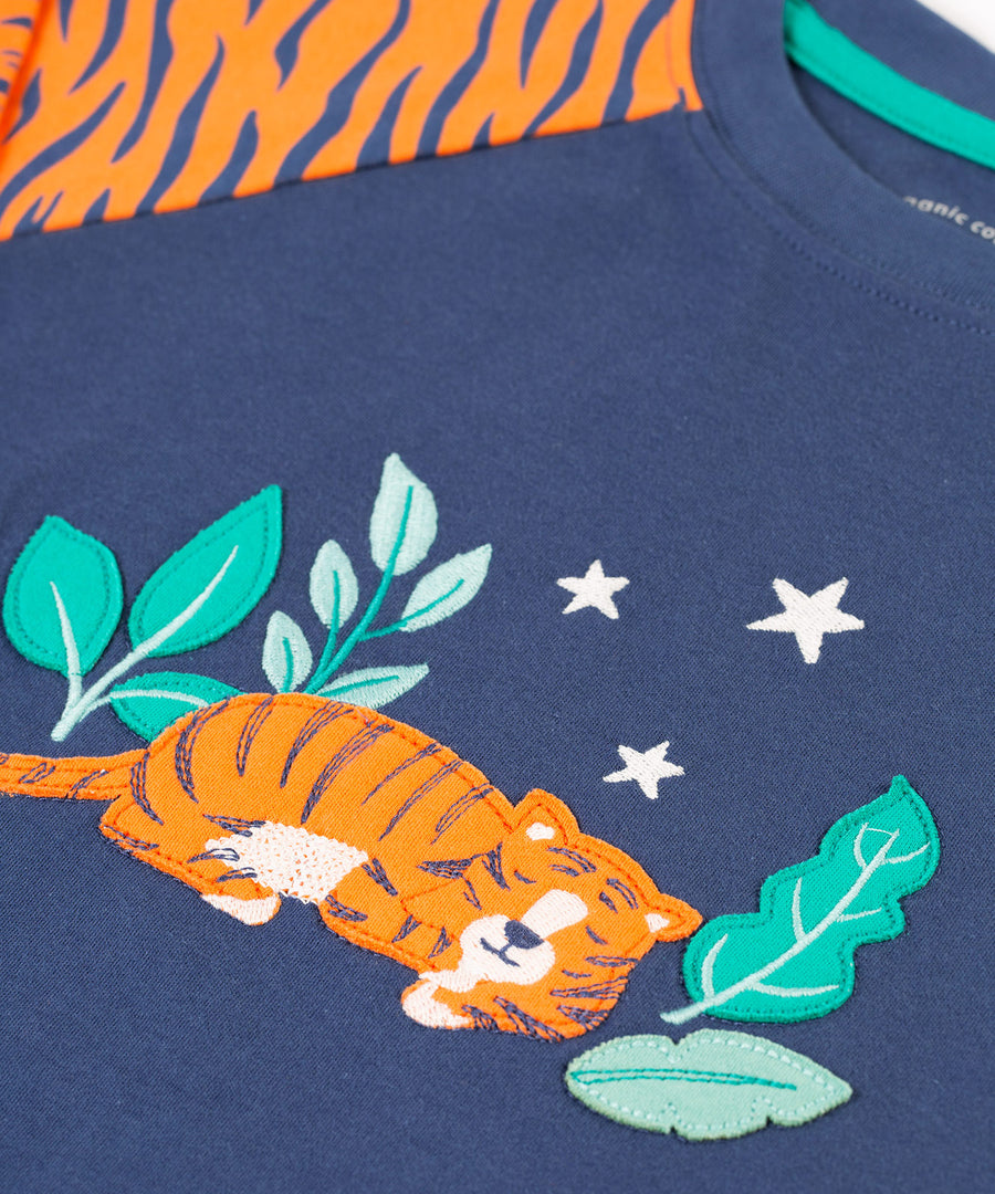 A closer look at the tiger and leaf applique on the front of the Frugi Jamie Jim Jams - Sleeping Tiger top