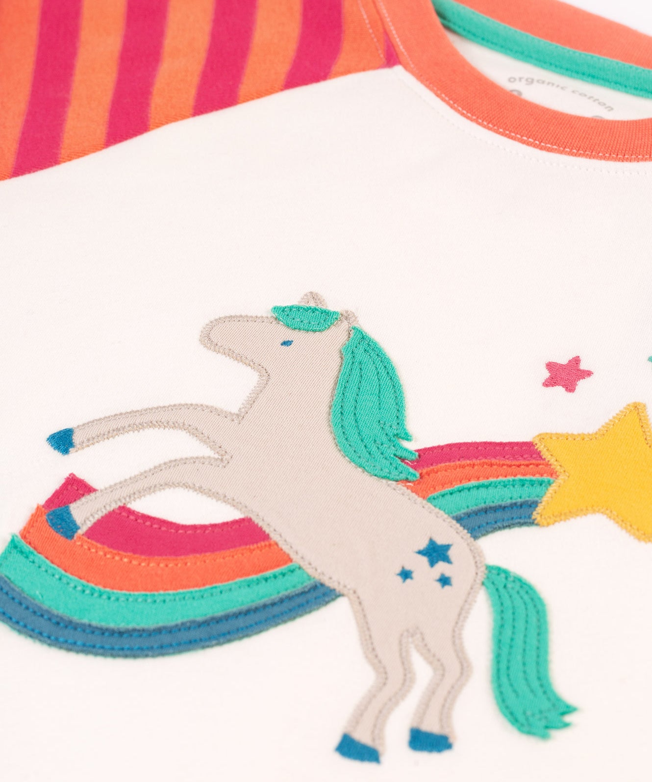 A closer look at the horse applique on the Frugi Jamie Jim Jams - Cantaloupe Stripe/Horse