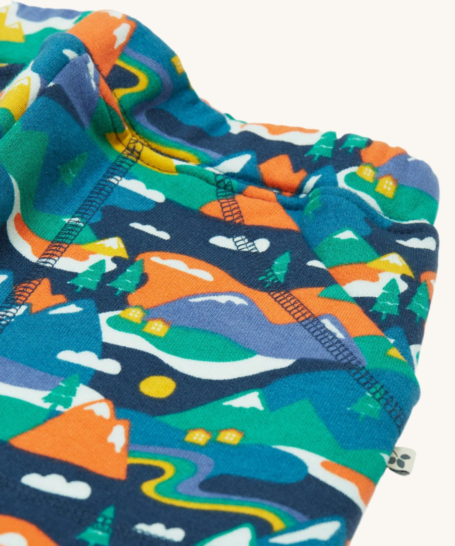 A closer look at the Alpine mountain print and pockets on the Frugi Malpas Joggers - Navy Alpine Adventures