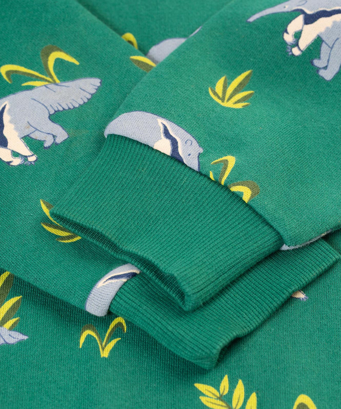 A closer look at the green, elasticated rib cuffs on the Frugi Superb Sweatshirt - Anteater Parade