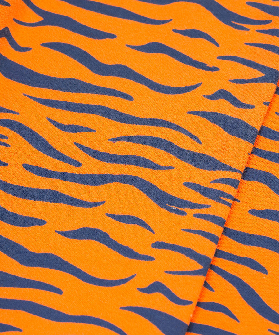 The tiger stripe print on the Frugi Jamie Jim Jams - Sleeping Tiger pyjama bottoms