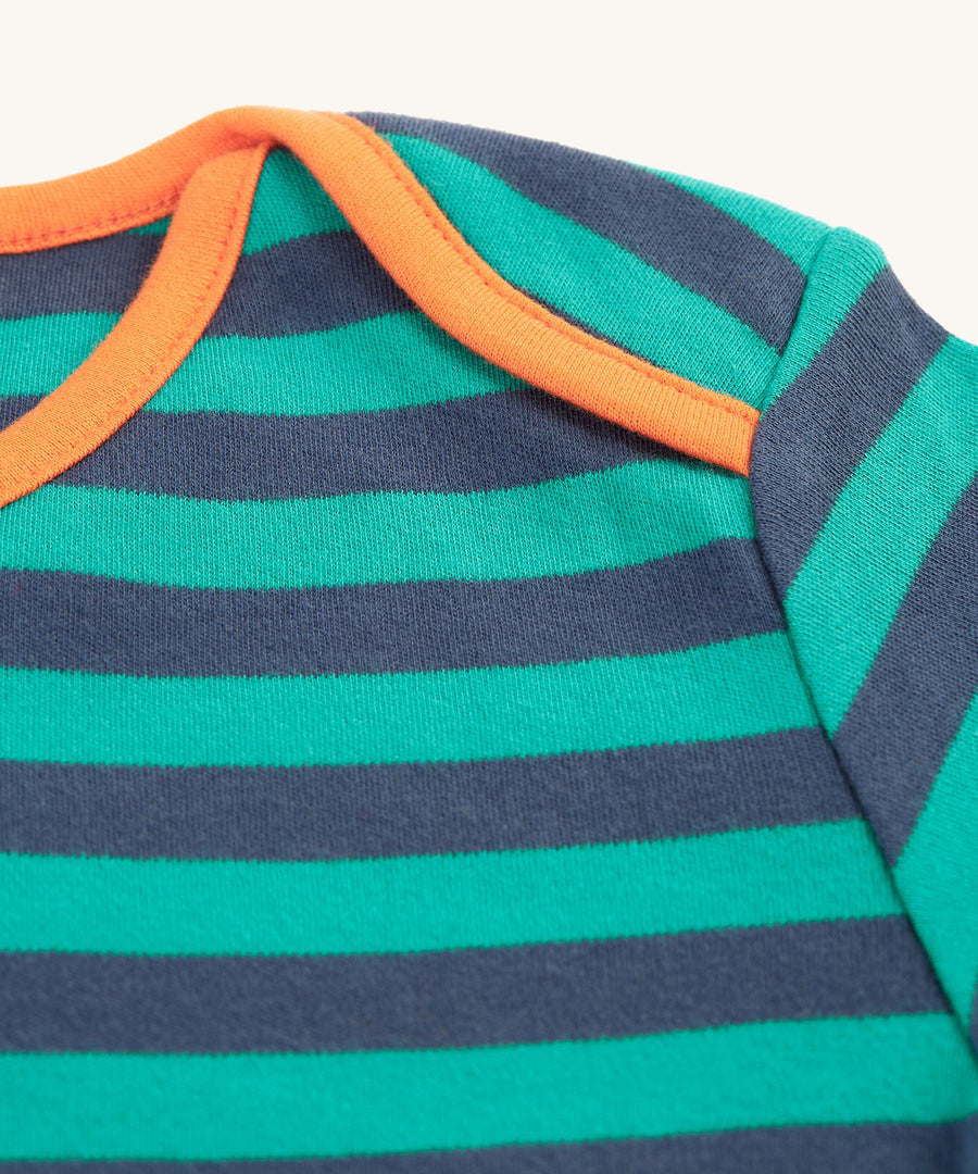 A closer look at the orange piping at the shoulder and neck of the Frugi Bobby Applique Top - Iguana Stripe/Tiger