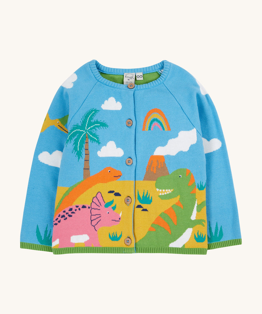 Frugi blue knitted cardigan dino design on a cream background.