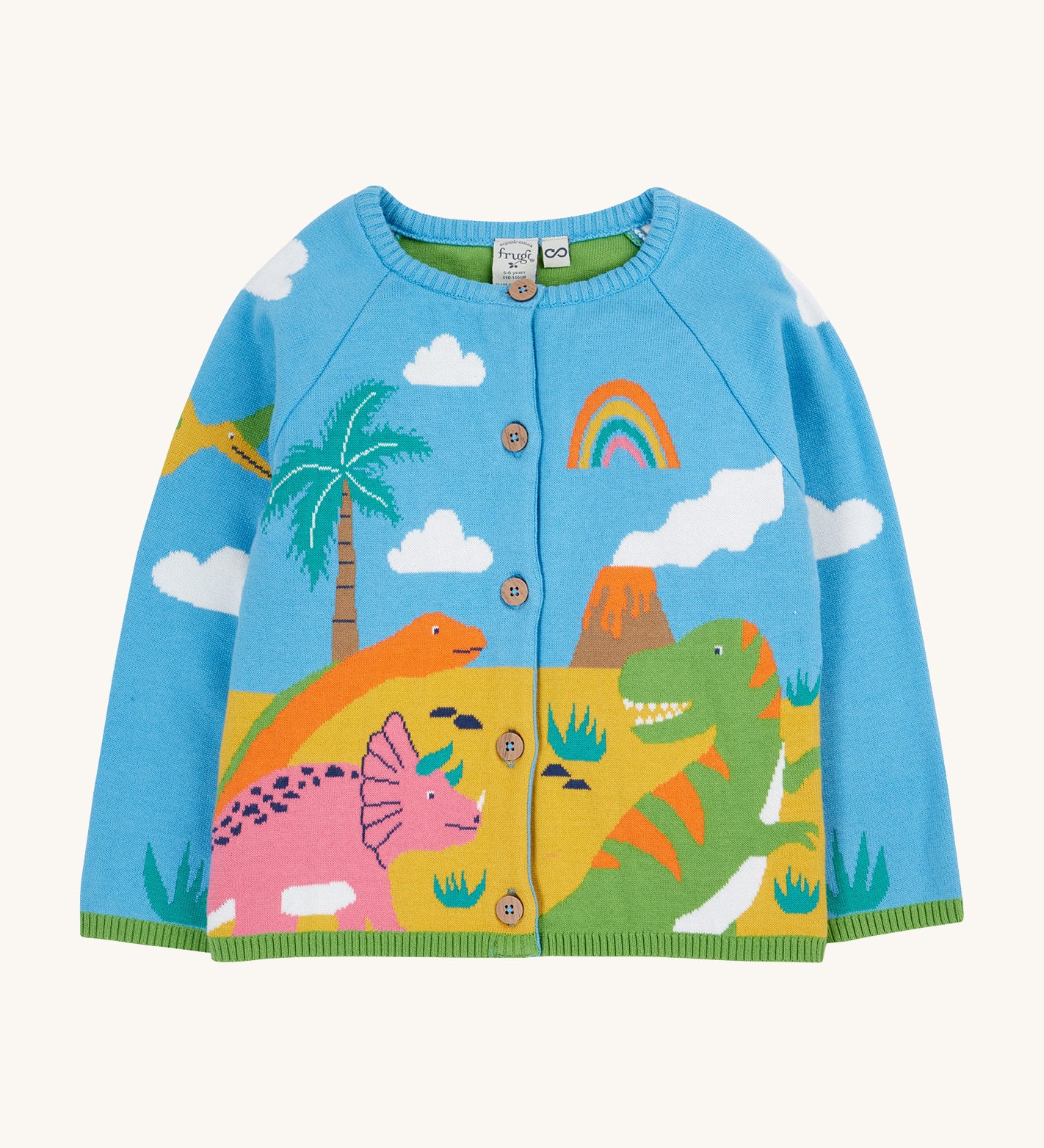 Frugi blue knitted cardigan dino design on a cream background.