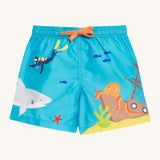 Frugi blue swim shorts deep dea diver design on a cream background.