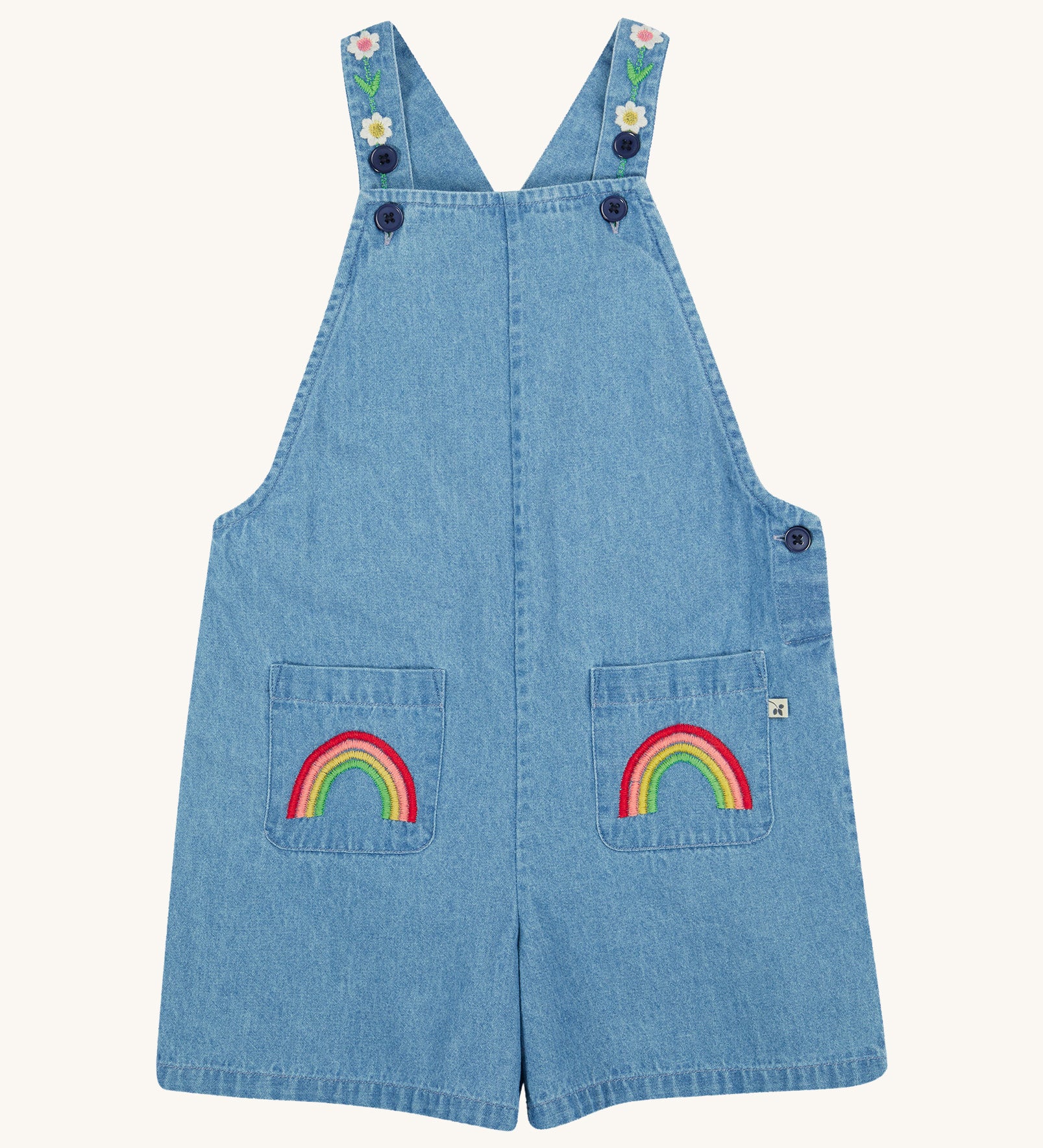 Frugi blue denim short dungarees rainbow design on a cream background.