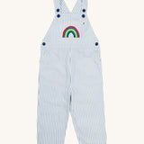 Frugi blue stripe dungarees rainbow design on a cream background.