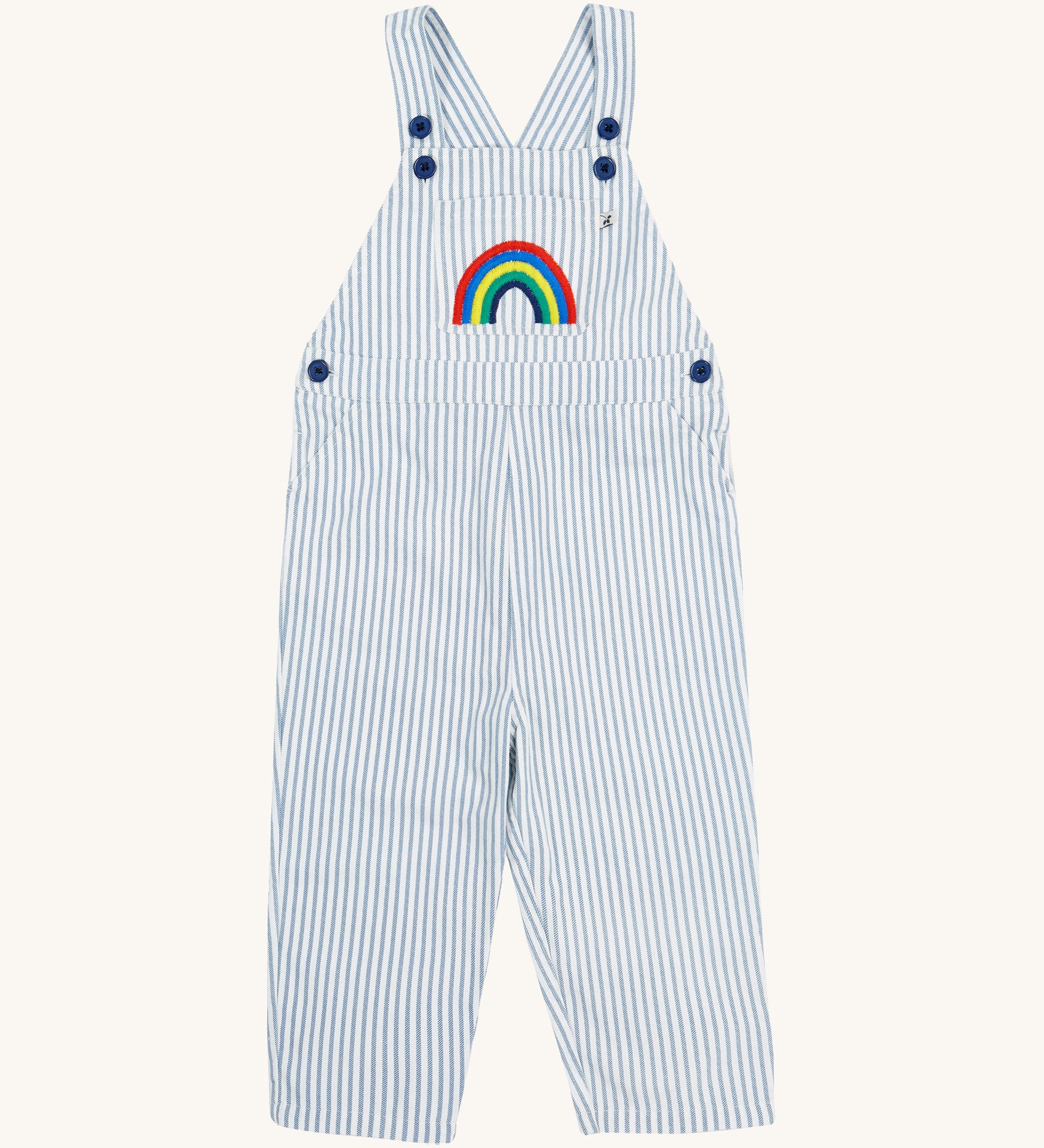 Frugi blue stripe dungarees rainbow design on a cream background.