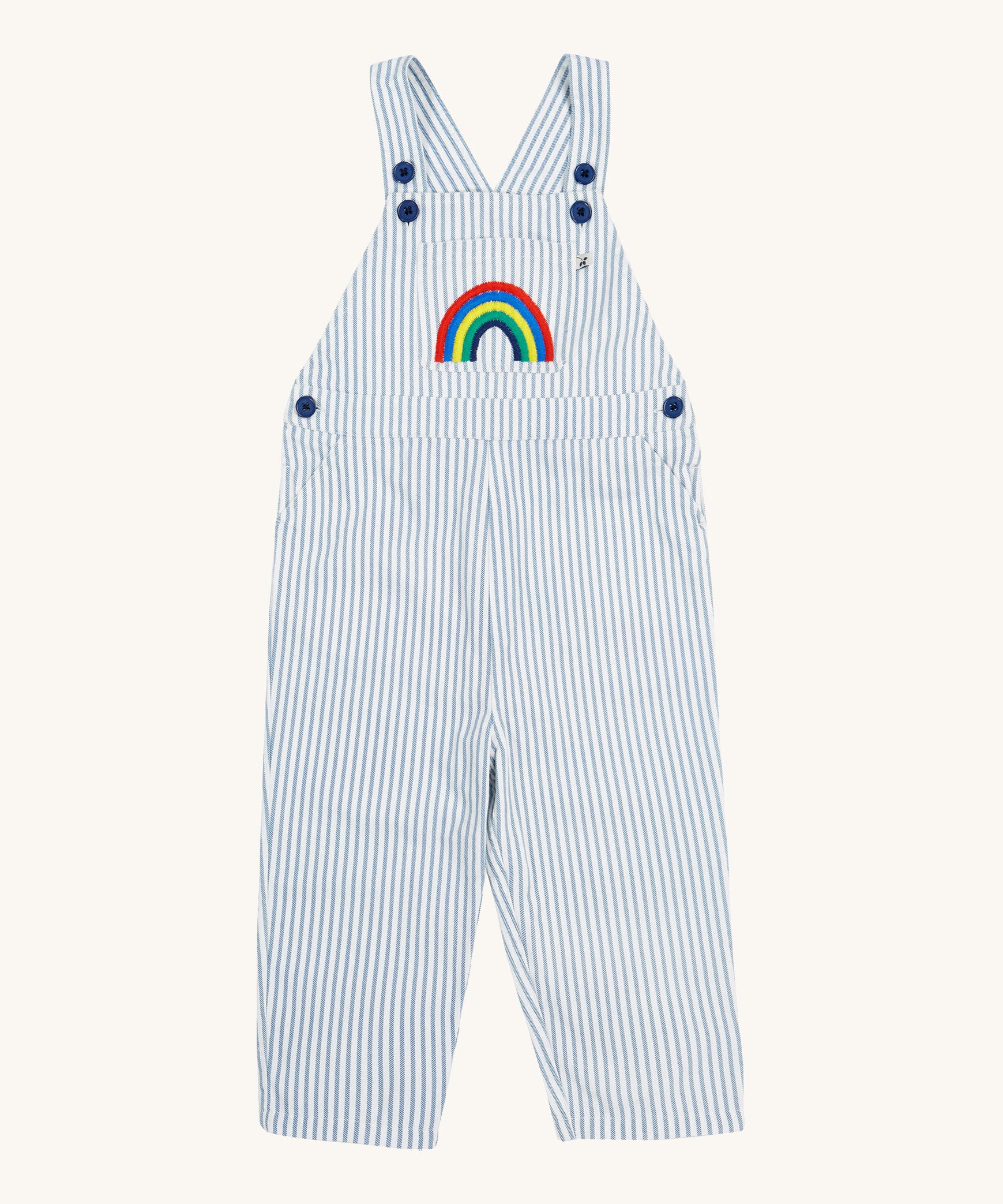 Frugi blue stripe dungarees rainbow design on a cream background.