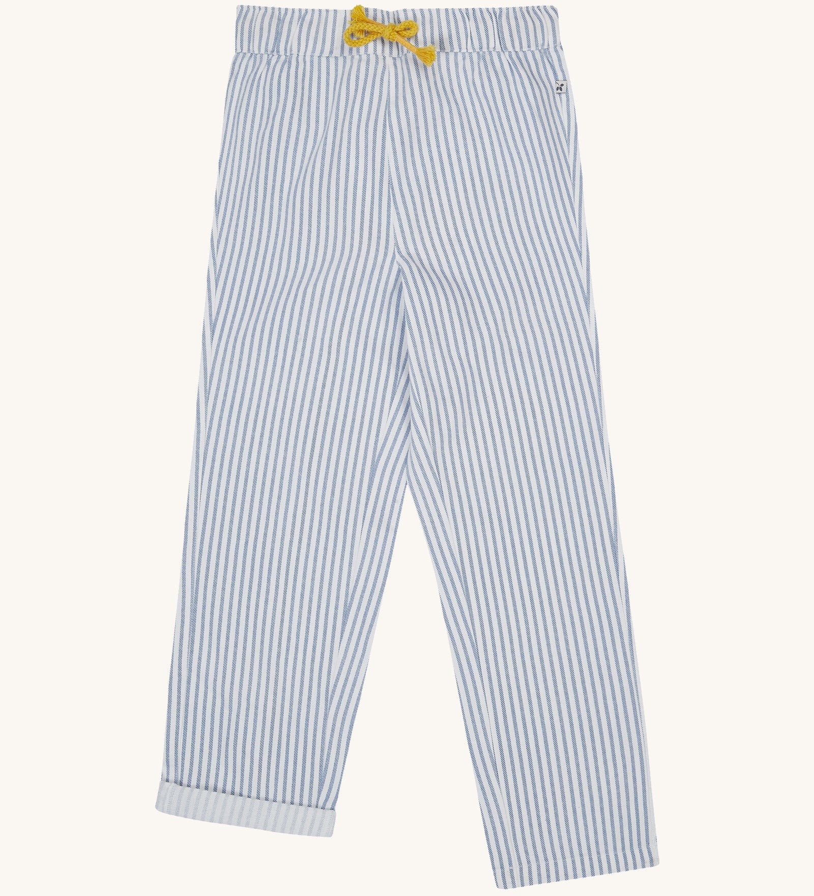 Frugi blue and white striped trousers on a cream background.